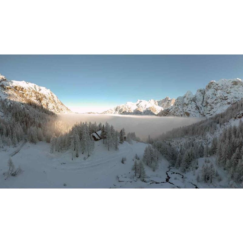 Erjavčeva hut in the front of the foggy valley of Kranjska Gora
